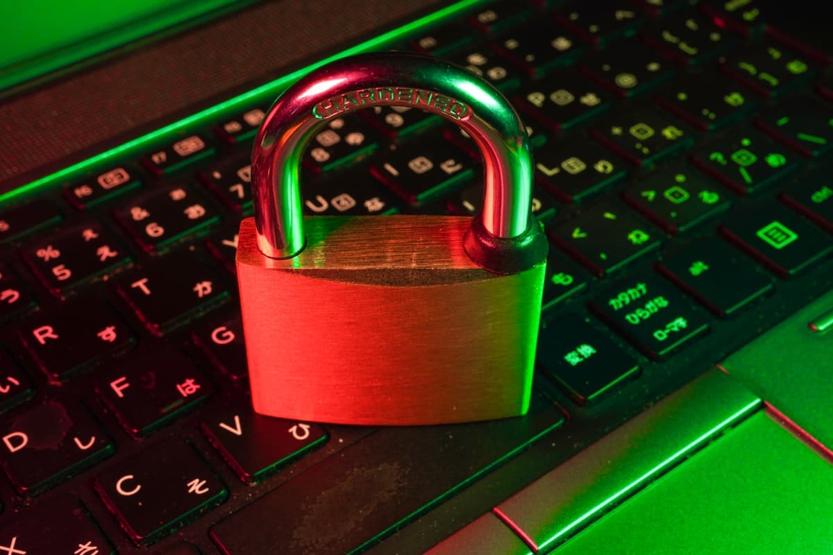 Digital padlock on a dark background representing cybersecurity